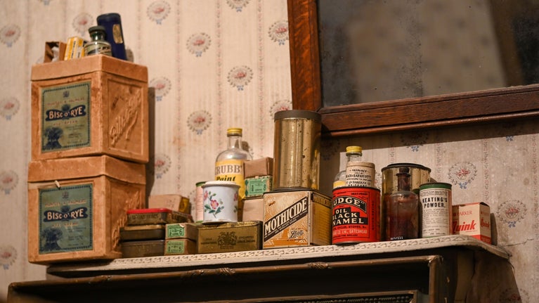Items stacked on a shelf in the Lumber Room